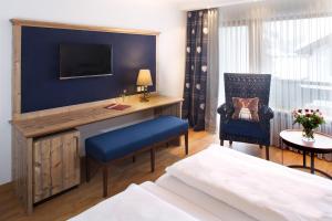 Postel nebo postele na pokoji v ubytování Hotel Menning ***S