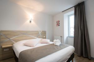 Postel nebo postele na pokoji v ubytování Le Relais Délys