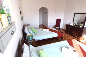 A bed or beds in a room at Lana Villa