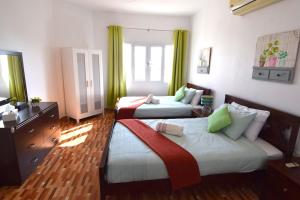 A bed or beds in a room at Lana Villa