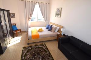 A bed or beds in a room at Lana Villa