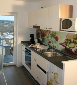 Η κουζίνα ή μικρή κουζίνα στο ApartPeterstor
