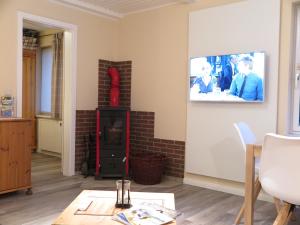 TV a/nebo společenská místnost v ubytování Ferienhaus Till & Lotte