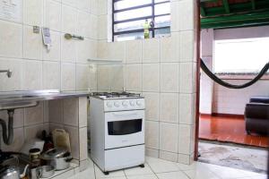 Virtuvė arba virtuvėlė apgyvendinimo įstaigoje Tião Botelho Guest House