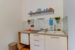 a kitchen with a sink and a counter top at BigBlue house in Veli Lošinj +44 photos