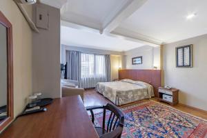 Postel nebo postele na pokoji v ubytování Hotel Fehmi Bey - Special Category