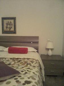 A bed or beds in a room at La Graziosa Dépendance