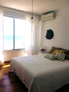 Llit o llits en una habitació de 19 Villa Playa Almadraba (Alicante)