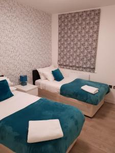 Ένα ή περισσότερα κρεβάτια σε δωμάτιο στο Vetrelax Chelmsford City Apartment