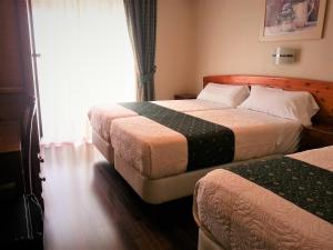 Posteľ alebo postele v izbe v ubytovaní Hotel Alameda Málaga