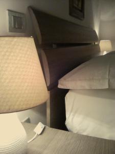 A bed or beds in a room at La Graziosa Dépendance