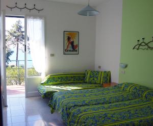 Postel nebo postele na pokoji v ubytování Resort La Francesca
