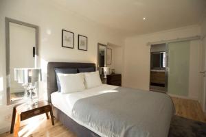 a bedroom with a large bed and a window at Olá Lisbon - Chiado III in Lisbon