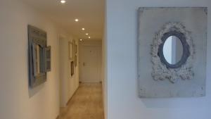 a hallway with a mirror on a wall at Gästehaus Maria in Rettenbach am Auerberg