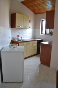 Kuchyň nebo kuchyňský kout v ubytování Apartments Lera