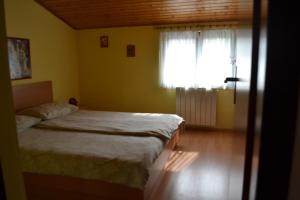 Postel nebo postele na pokoji v ubytování Apartments Lera