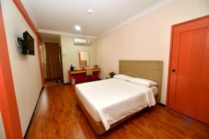 Classic Boutique Hotel Kuantan客房内的一张或多张床位