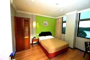 Classic Boutique Hotel Kuantan客房内的一张或多张床位