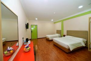 Classic Boutique Hotel Kuantan客房内的一张或多张床位