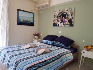 Postel nebo postele na pokoji v ubytování Sounio Palea Heaven