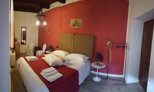 A bed or beds in a room at Torre della Botonta