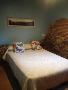 Łóżko lub łóżka w pokoju w obiekcie Arroyo Colladillos y Caprichosa