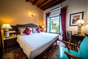 Postelja oz. postelje v sobi nastanitve Yeng Keng Hotel