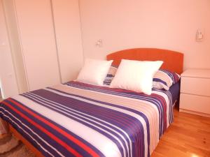 Posteľ alebo postele v izbe v ubytovaní Apartman Karlo