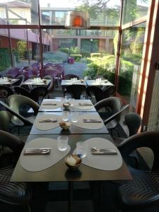 Restavracija oz. druge možnosti za prehrano v nastanitvi Hotel Clocchiatti Next