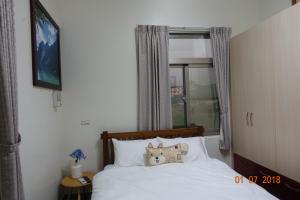 Postel nebo postele na pokoji v ubytování Fu Courtyard Homestay