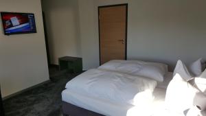 Postel nebo postele na pokoji v ubytování Hotel Landhaus Feyen