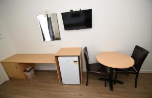 Kuchyň nebo kuchyňský kout v ubytování Dandenong Motel