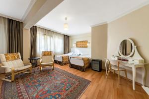 Postel nebo postele na pokoji v ubytování Hotel Fehmi Bey - Special Category