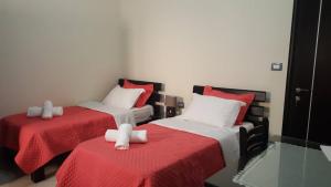 Ein Bett oder Betten in einem Zimmer der Unterkunft Villa Nicolaos Ksamil