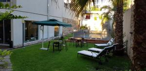 Um jardim em Villaggio Hotel Boutique