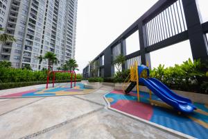 a playground with a slide in a building at MRT Apartment In Masteri Thao Dien in Ho Chi Minh City