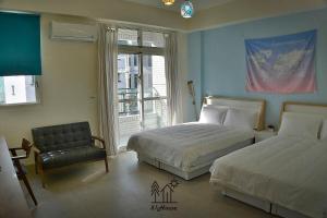 Rúm í herbergi á No.51 Ruisui Homestay