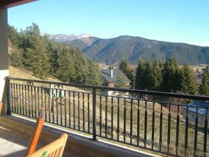 a balcony with a view of trees and mountains at Le Calmadou in Formiguères