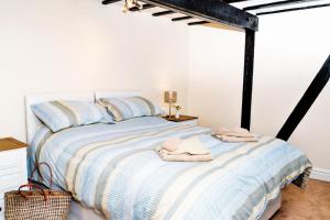 Ένα ή περισσότερα κρεβάτια σε δωμάτιο στο Wrenbury Mill Apartment
