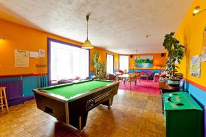 a pool table in a room with colorful walls at Pitlochry Backpackers in Pitlochry