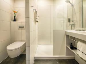 Koupelna v ubytování LOGINN Hotel Leipzig