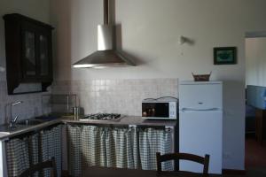 Kuchyň nebo kuchyňský kout v ubytování Agriturismo Gli Archi