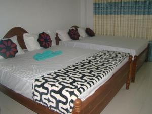 Letto o letti in una camera di Thuruliya Residence