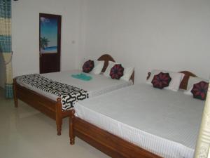 Letto o letti in una camera di Thuruliya Residence