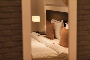 Postel nebo postele na pokoji v ubytování Hotel Rastoni - Helvetia
