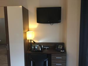Kuchyň nebo kuchyňský kout v ubytování Simply Rooms & Suites