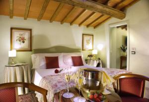 a bedroom with a bed with a table and chairs at JOIVY Together Florence Secret Nest in Florence