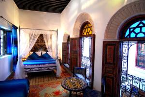 A bed or beds in a room at Dar Hafsa