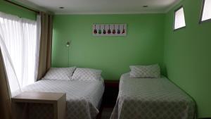 Voodi või voodid majutusasutuse Apart Hotel Colors toas