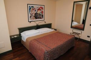 Postel nebo postele na pokoji v ubytování Hotel Del Riale + 37 fotografií